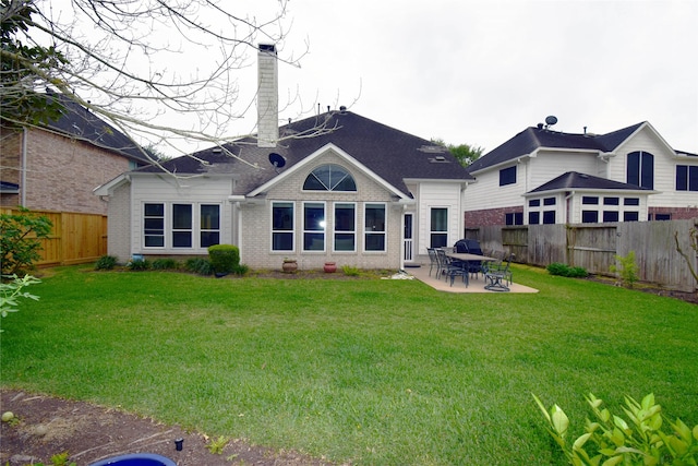 5810 Brook Bend Dr, Sugar Land, TX 77479 - rear view of house featuring brick siding, a fenced backyard, a patio, and a chimney
