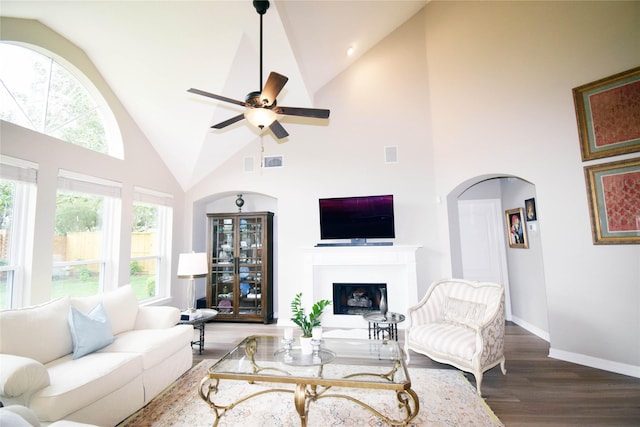 5810 Brook Bend Dr, Sugar Land, TX 77479 - living room featuring high vaulted ceiling, wood finished floors, a fireplace, and ceiling fan