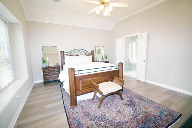 5810 Brook Bend Dr, Sugar Land, TX 77479 - bedroom featuring ornamental molding, light wood-type flooring, lofted ceiling, multiple windows, and ensuite bathroom
