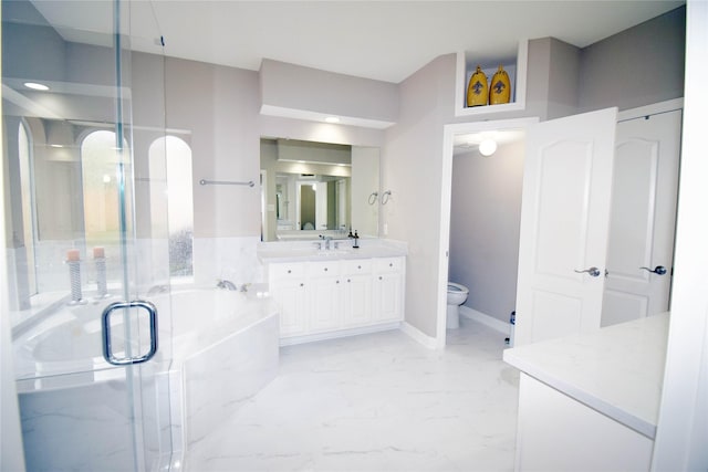 5810 Brook Bend Dr, Sugar Land, TX 77479 - bathroom featuring vanity, a garden tub, a stall shower, and marble finish flooring