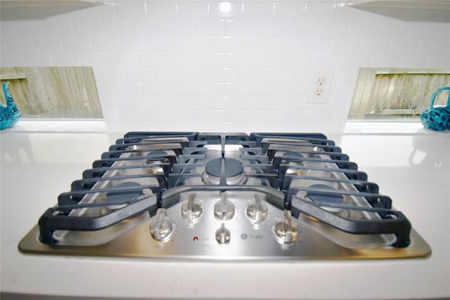 5810 Brook Bend Dr, Sugar Land, TX 77479 - kitchen view of stainless steel gas cooktop and backsplash