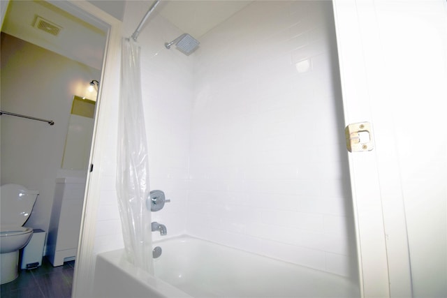 5810 Brook Bend Dr, Sugar Land, TX 77479 - bathroom featuring toilet and shower / tub combo