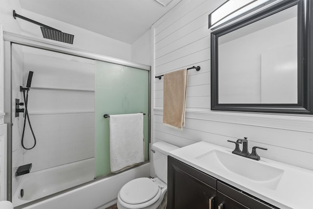 10023 Ash Fork Dr, Houston, TX 77064 - bathroom with toilet, combined bath / shower with glass door, vanity, and wooden walls