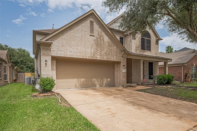 2938 Intrepid Elm St, Houston, TX 77084 - view of front facade with cooling unit, brick siding, driveway, and a porch