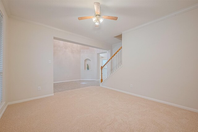 2938 Intrepid Elm St, Houston, TX 77084 - unfurnished room with crown molding, light carpet, ceiling fan, stairs, and baseboards