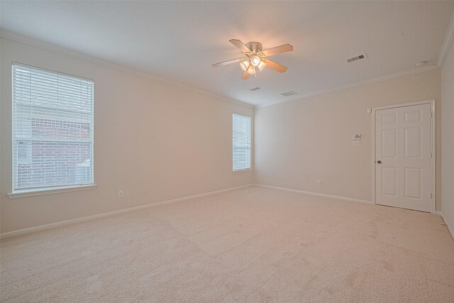 2938 Intrepid Elm St, Houston, TX 77084 - empty room with crown molding, a ceiling fan, baseboards, and light colored carpet