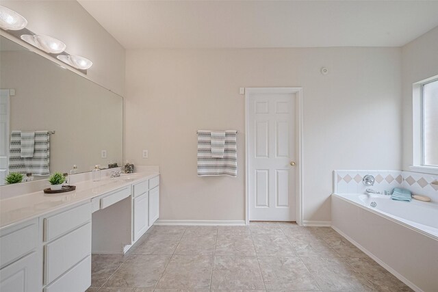 2938 Intrepid Elm St, Houston, TX 77084 - bathroom featuring vanity, a bath, and tile patterned flooring