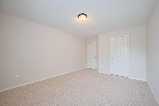 2938 Intrepid Elm St, Houston, TX 77084 - unfurnished bedroom featuring light carpet and baseboards