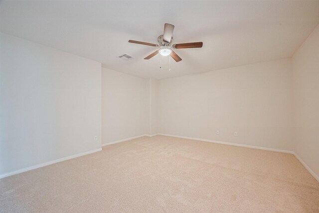 2938 Intrepid Elm St, Houston, TX 77084 - empty room featuring light carpet, a ceiling fan, and baseboards