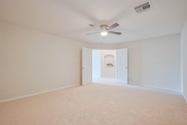2938 Intrepid Elm St, Houston, TX 77084 - spare room with light colored carpet, ceiling fan, and baseboards