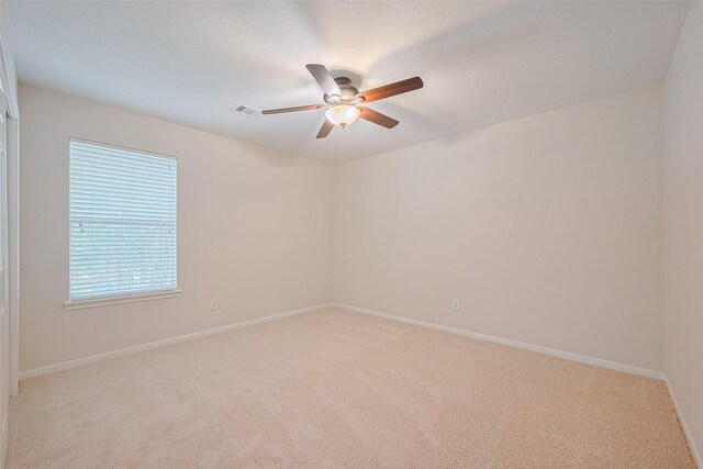 2938 Intrepid Elm St, Houston, TX 77084 - unfurnished room featuring light colored carpet, ceiling fan, and baseboards