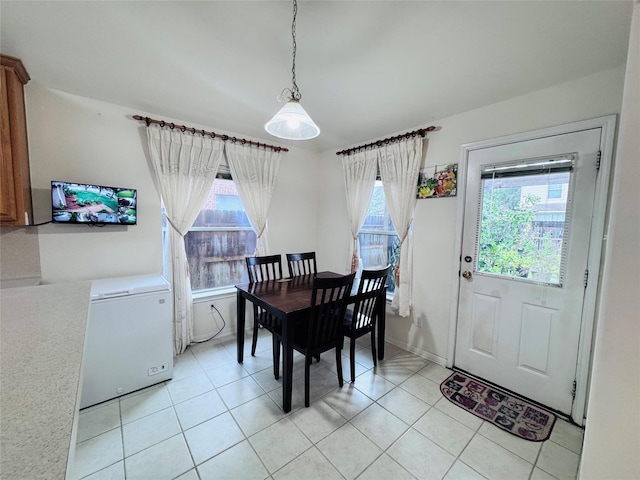 15102 Millers Run Ln, Sugar Land, TX 77498 - dining room with plenty of natural light, light tile patterned floors, and baseboards