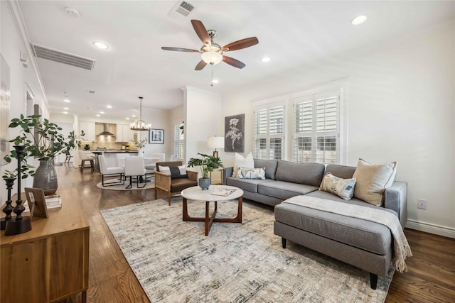 2621 Morrison St, Houston, TX 77009 - living area featuring a ceiling fan, wood finished floors, a chandelier, recessed lighting, and baseboards