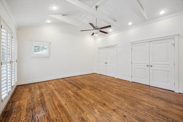 2621 Morrison St, Houston, TX 77009 - unfurnished bedroom with multiple closets, ornamental molding, wood finished floors, baseboards, and recessed lighting