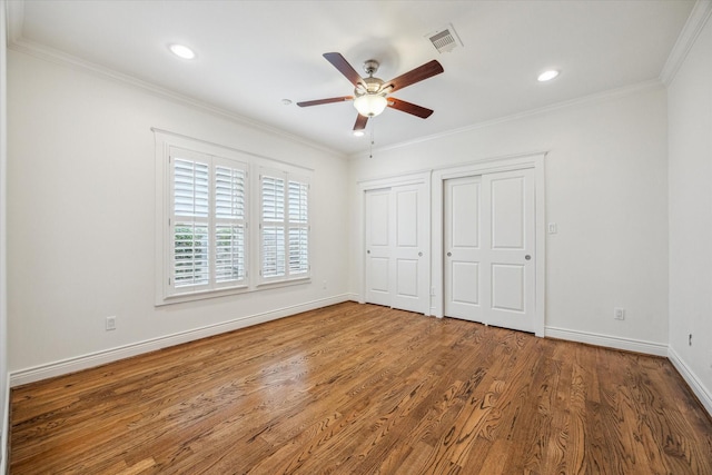 2621 Morrison St, Houston, TX 77009 - unfurnished bedroom with baseboards, wood finished floors, crown molding, recessed lighting, and a ceiling fan