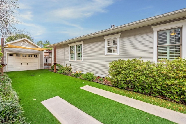 2621 Morrison St, Houston, TX 77009 - view of property exterior featuring an outdoor structure, a yard, a garage, and driveway