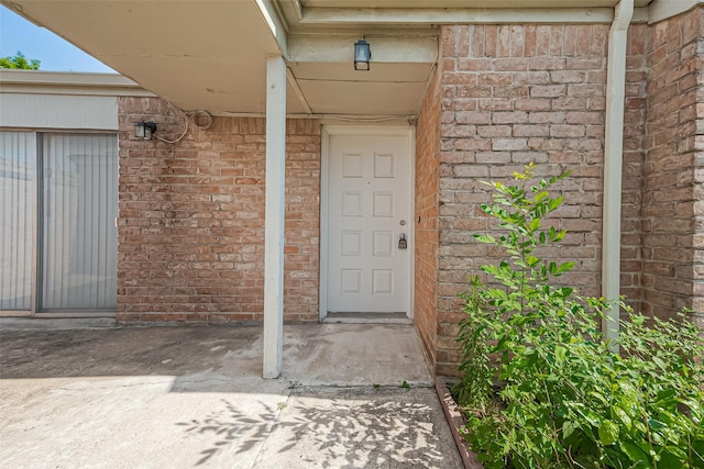 13207 Robinglen Dr, Houston, TX 77083 - view of exterior entry featuring brick siding