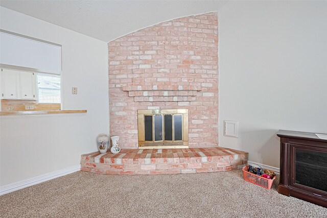 13207 Robinglen Dr, Houston, TX 77083 - unfurnished living room with a fireplace, vaulted ceiling, carpet, and baseboards