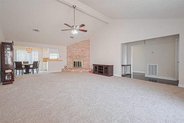 13207 Robinglen Dr, Houston, TX 77083 - unfurnished living room with a ceiling fan, carpet, beamed ceiling, a chandelier, and baseboards