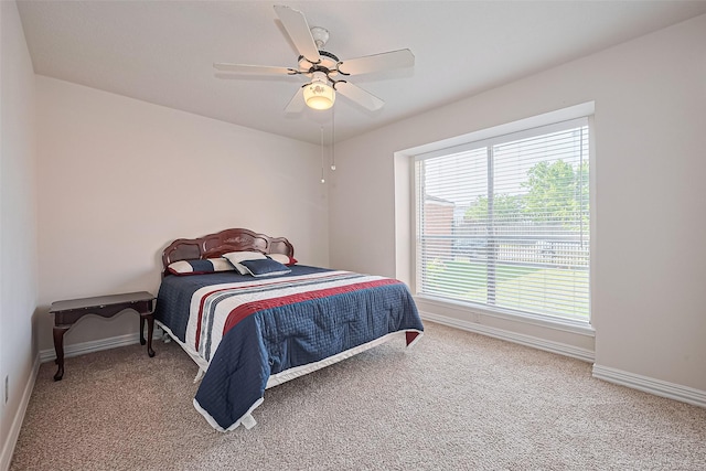 13207 Robinglen Dr, Houston, TX 77083 - bedroom featuring carpet flooring, baseboards, and ceiling fan