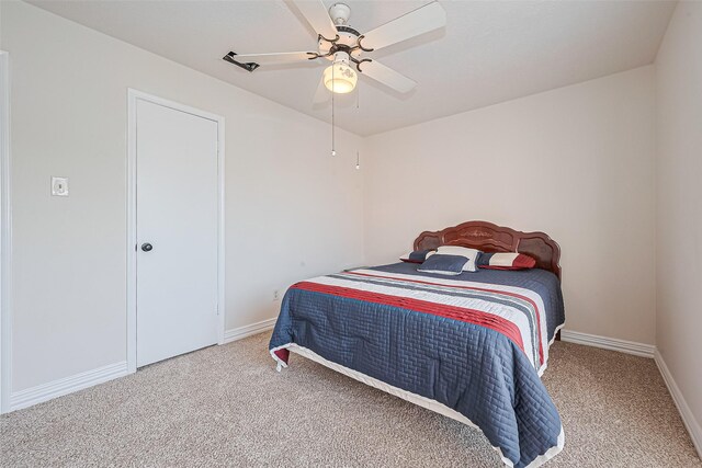 13207 Robinglen Dr, Houston, TX 77083 - bedroom with carpet flooring, baseboards, and ceiling fan