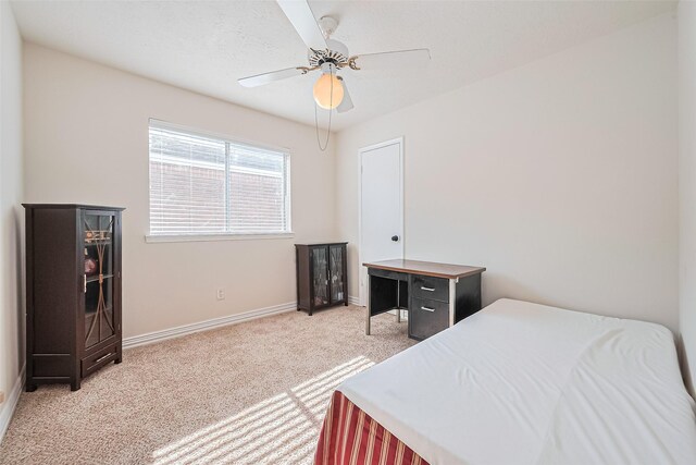 13207 Robinglen Dr, Houston, TX 77083 - bedroom featuring light colored carpet, baseboards, and a ceiling fan