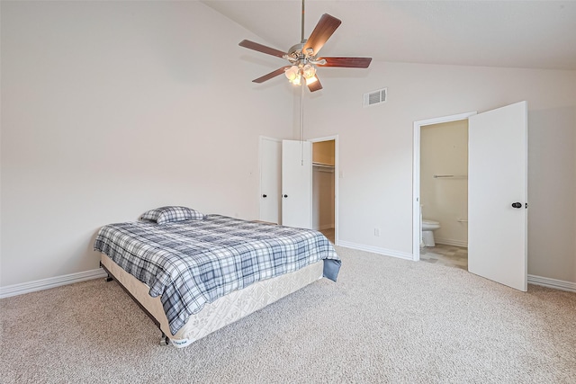 13207 Robinglen Dr, Houston, TX 77083 - bedroom featuring high vaulted ceiling, light colored carpet, baseboards, and a walk in closet