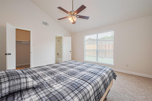 13207 Robinglen Dr, Houston, TX 77083 - bedroom with baseboards, a walk in closet, light carpet, ceiling fan, and high vaulted ceiling