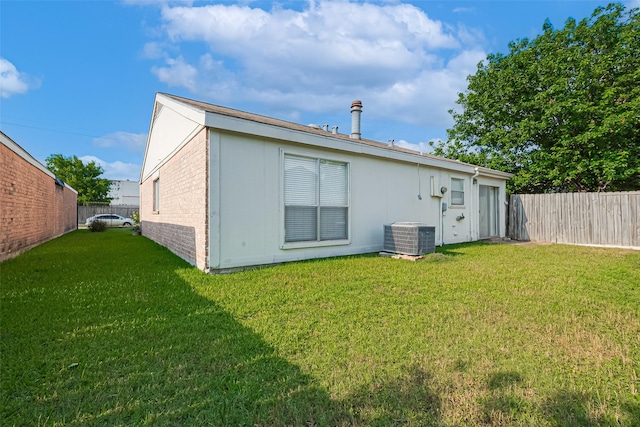 13207 Robinglen Dr, Houston, TX 77083 - back of property with brick siding and central AC