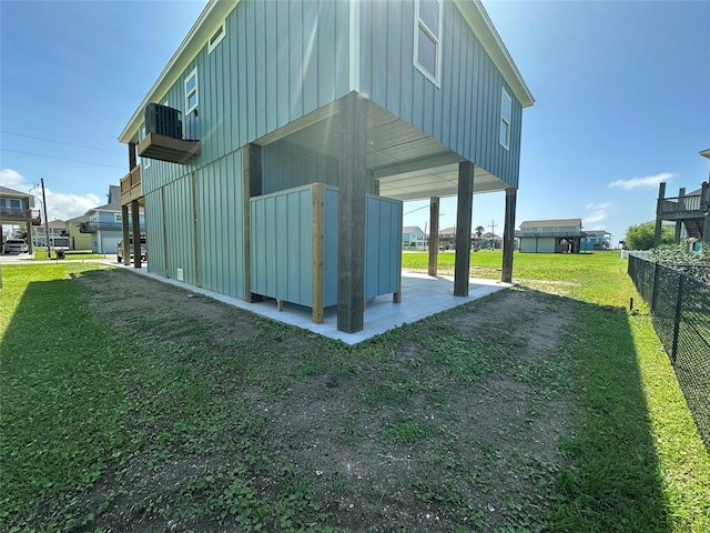 969 Bahama Rd, Crystal Beach, TX 77650 - rear view of property with board and batten siding