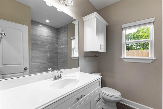 6510 Arabella, Houston, TX 77091 - full bath featuring vanity, toilet, tiled shower, and baseboards
