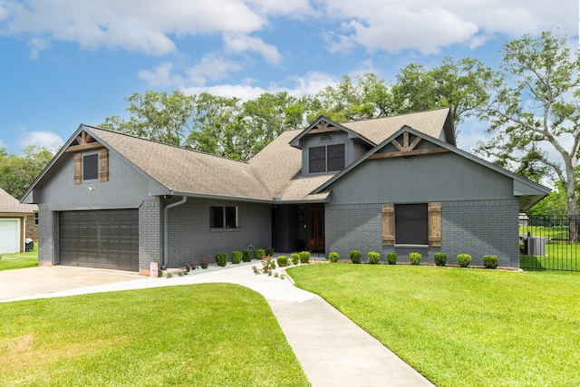 307 County Road 416, Brazoria, TX 77422 - view of front facade with brick siding, a shingled roof, concrete driveway, and a garage