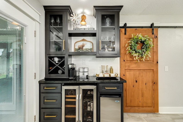 307 County Road 416, Brazoria, TX 77422 - indoor dry bar featuring wine cooler, decorative backsplash, and baseboards