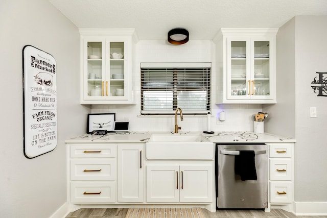 307 County Road 416, Brazoria, TX 77422 - kitchen featuring dishwasher, a sink, tasteful backsplash, white cabinetry, and glass insert cabinets