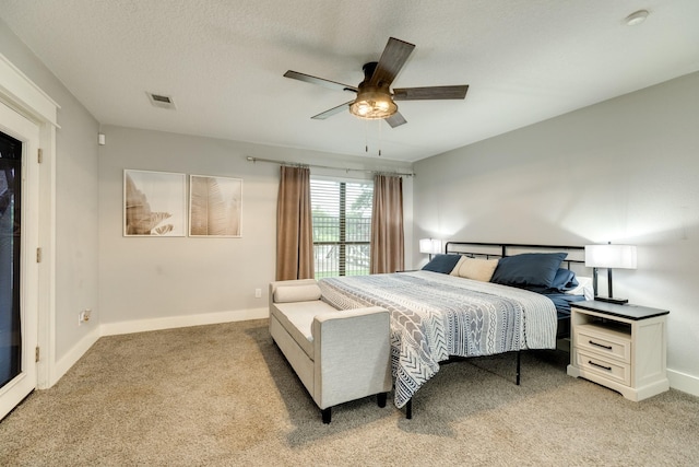 307 County Road 416, Brazoria, TX 77422 - bedroom featuring light colored carpet, baseboards, ceiling fan, and a textured ceiling
