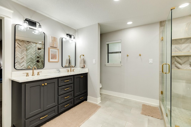 307 County Road 416, Brazoria, TX 77422 - full bath with double vanity, a stall shower, toilet, baseboards, and tile patterned floors