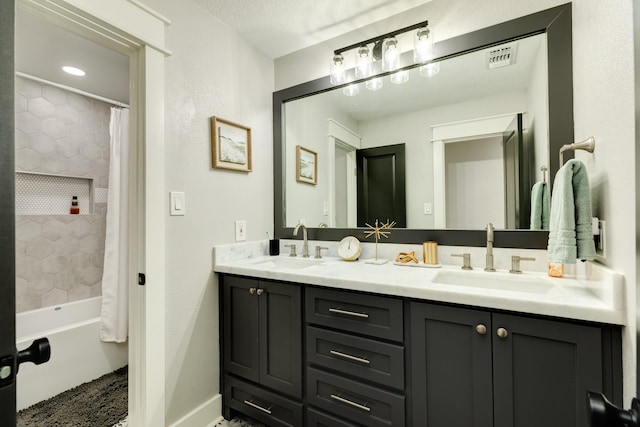 307 County Road 416, Brazoria, TX 77422 - bathroom featuring double vanity, shower / bath combination with curtain, and baseboards