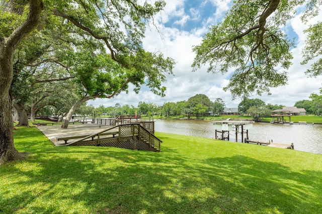 307 County Road 416, Brazoria, TX 77422 - dock area featuring a yard, a deck with water view, and stairway