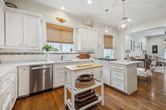 1216 Potomac Dr, Houston, TX 77057 - kitchen featuring appliances with stainless steel finishes, a sink, a peninsula, light countertops, and backsplash