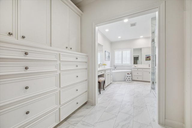 1216 Potomac Dr, Houston, TX 77057 - full bath featuring vanity, marble look tile flooring, a freestanding bath, a stall shower, and recessed lighting