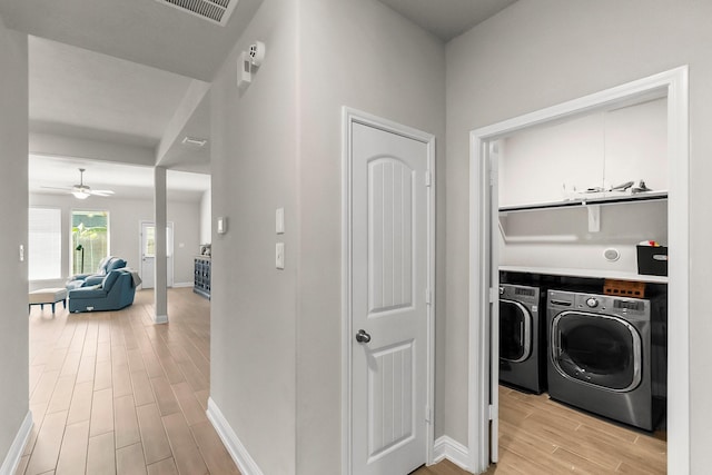 8202 Lockridge Terrace Ln, Cypress, TX 77433 - laundry area featuring separate washer and dryer, light wood-style floors, baseboards, and ceiling fan