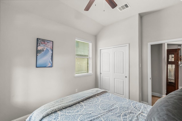 8202 Lockridge Terrace Ln, Cypress, TX 77433 - bedroom with baseboards, a closet, lofted ceiling, and a ceiling fan