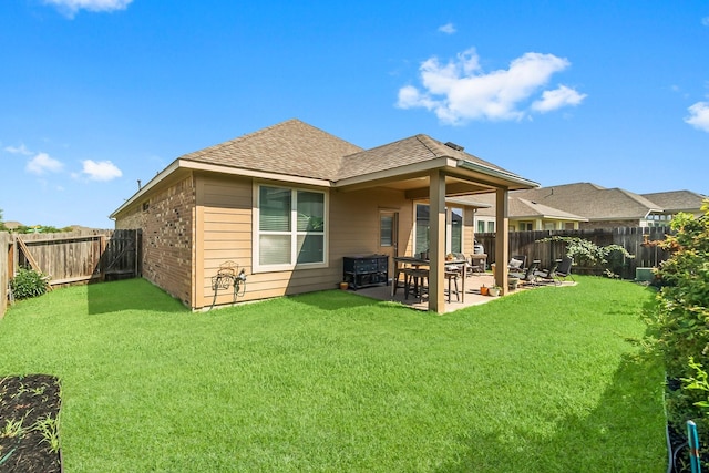 8202 Lockridge Terrace Ln, Cypress, TX 77433 - back of property featuring roof with shingles, a patio, and brick siding
