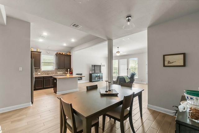 8202 Lockridge Terrace Ln, Cypress, TX 77433 - dining area with light wood finished floors, baseboards, ceiling fan, and recessed lighting