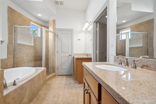 5012 Schuler St, Houston, TX 77007 - bathroom featuring a stall shower, two vanities, tile patterned floors, and a bath