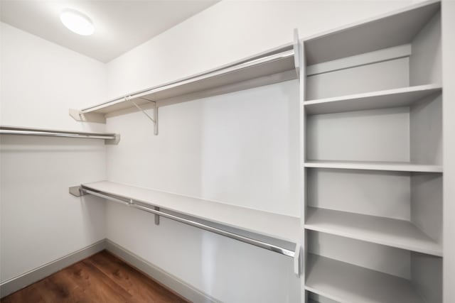 5012 Schuler St, Houston, TX 77007 - walk in closet with dark wood-type flooring
