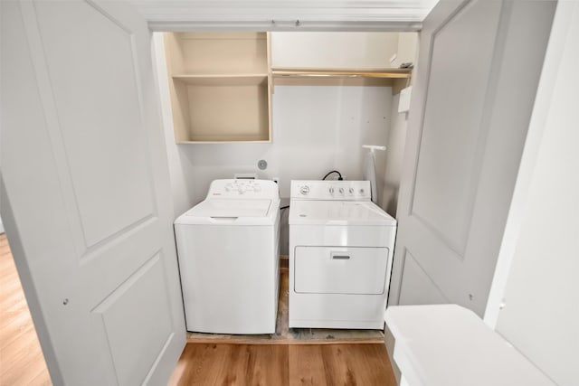 5012 Schuler St, Houston, TX 77007 - laundry room with washer and dryer and light wood-type flooring