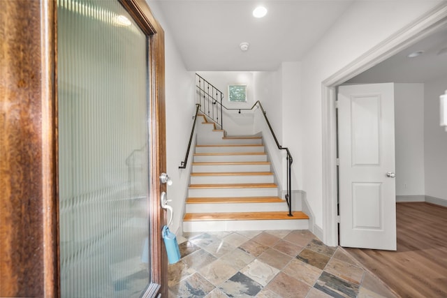 5012 Schuler St, Houston, TX 77007 - stairs featuring baseboards, stone tile floors, and recessed lighting