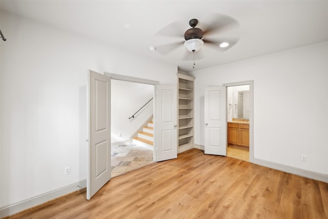 5012 Schuler St, Houston, TX 77007 - unfurnished bedroom with light wood-type flooring, ensuite bathroom, baseboards, and ceiling fan