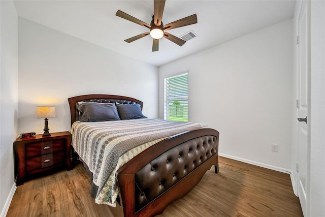 5003 Stratton Ln, Rosharon, TX 77583 - bedroom with baseboards, wood finished floors, and a ceiling fan